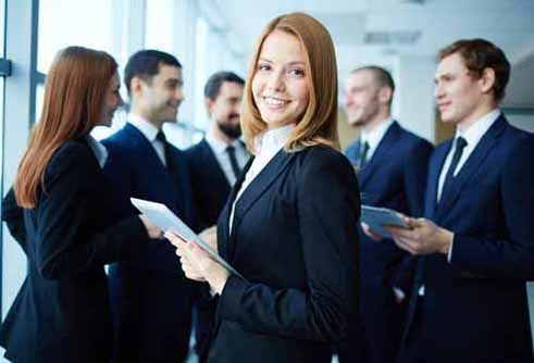 An employee at a finance company smiles